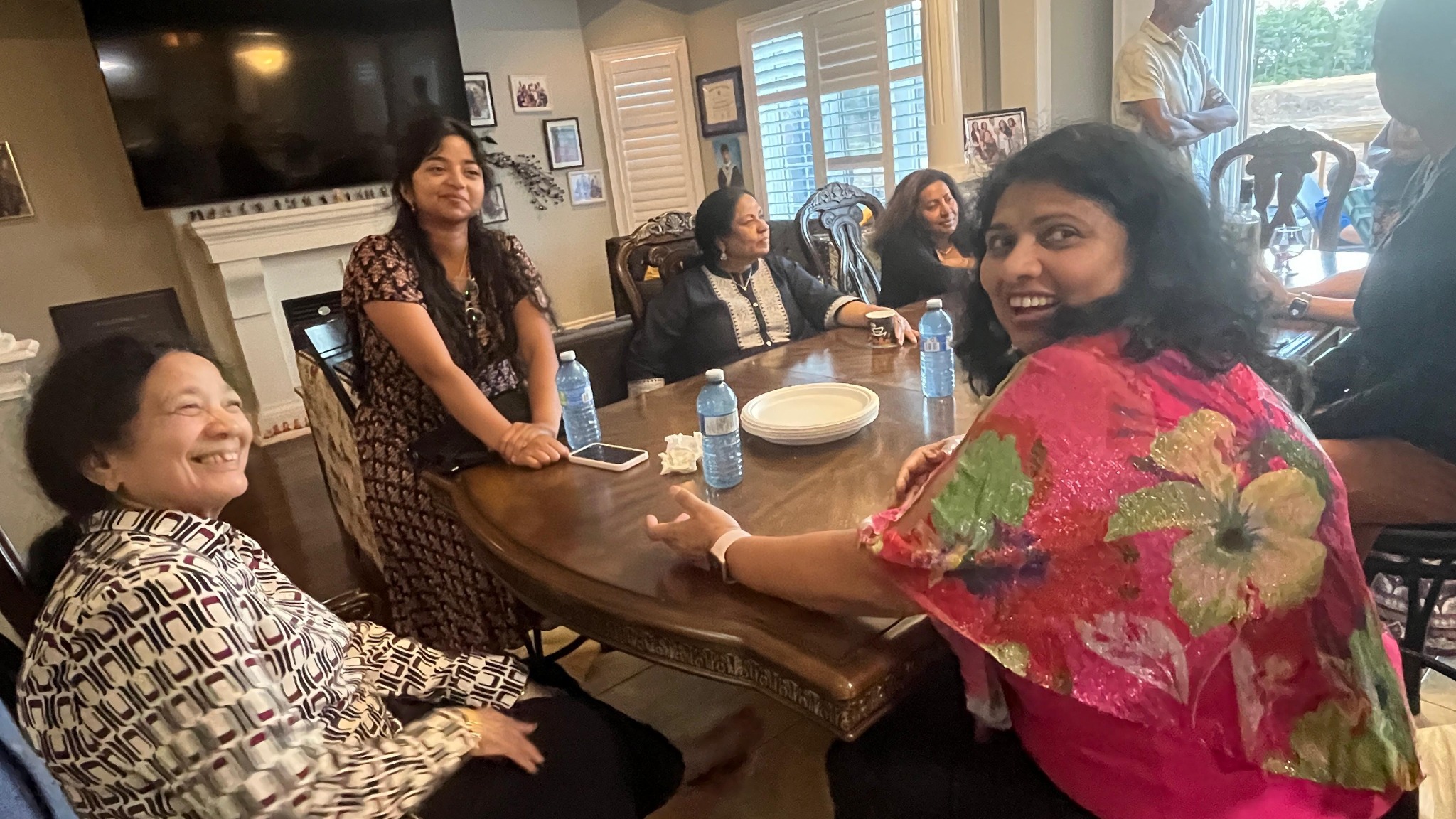 Friends around dining table