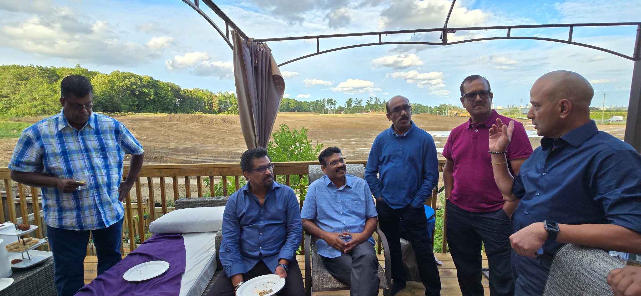 Friends talking together on the deck