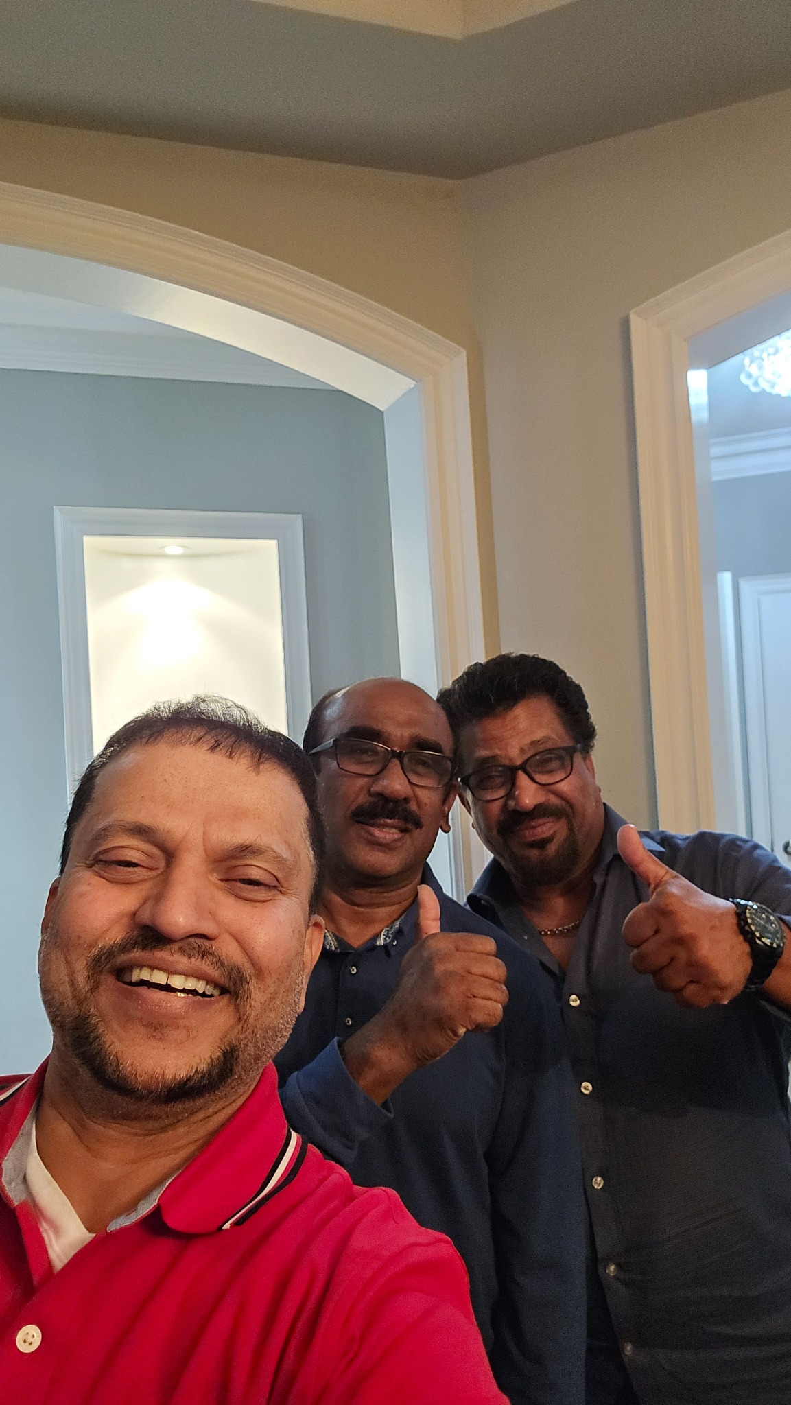Three friends smiling for a selfie