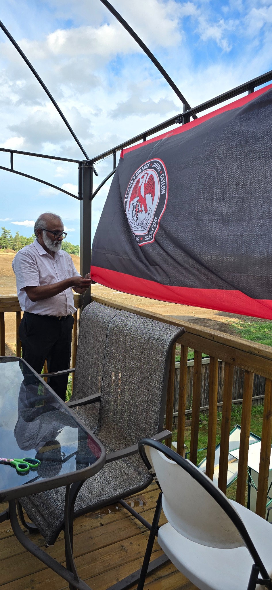 SJC85 banner being arranged outdoors